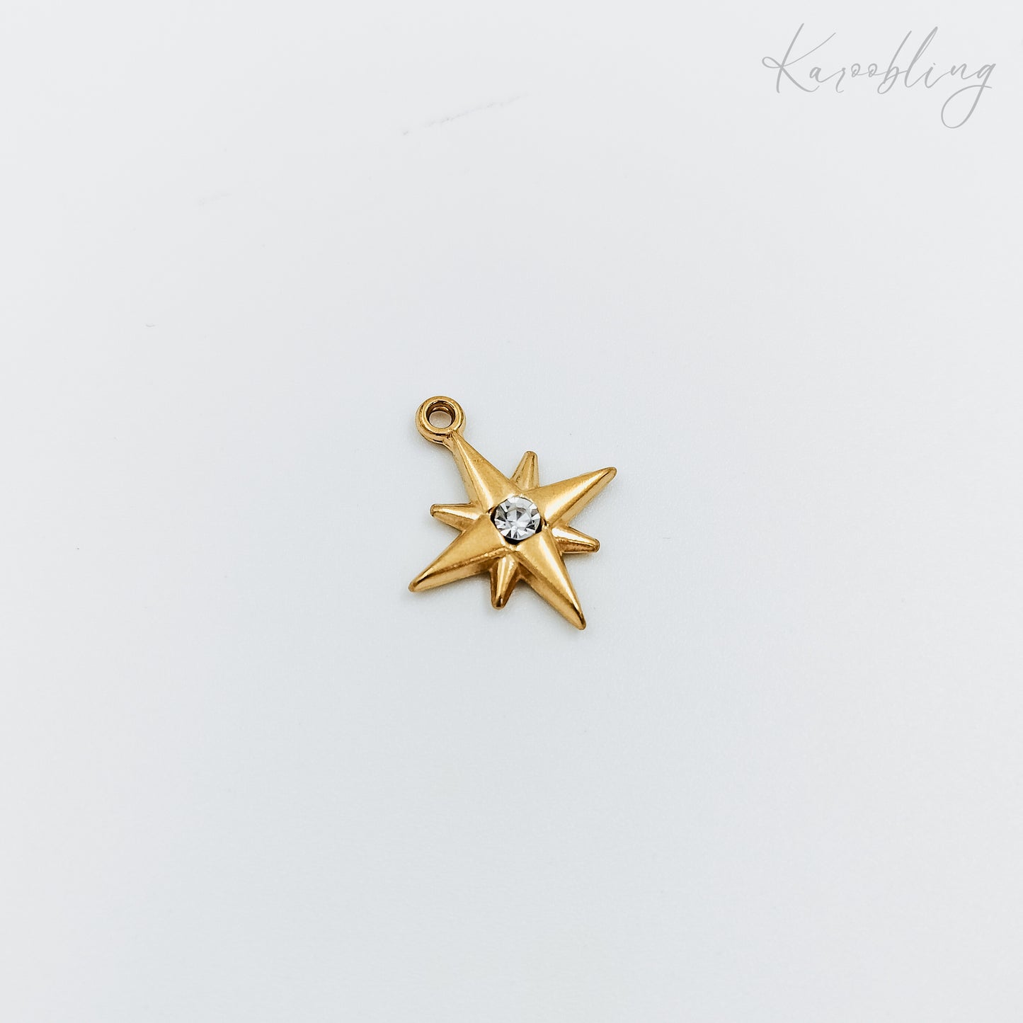 gold plated rhinestone starburst charm (water & tarnish proof)