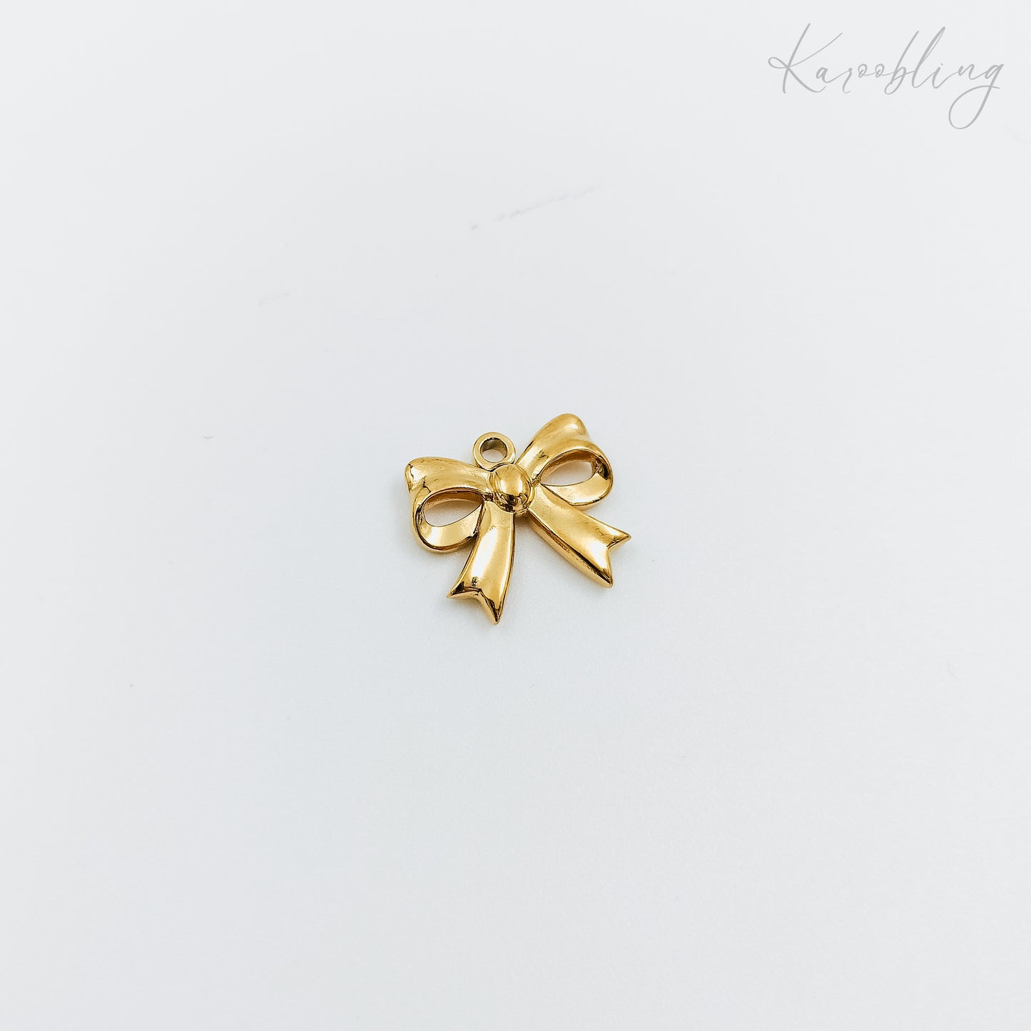 medium gold plated bow charm (water & tarnish proof)