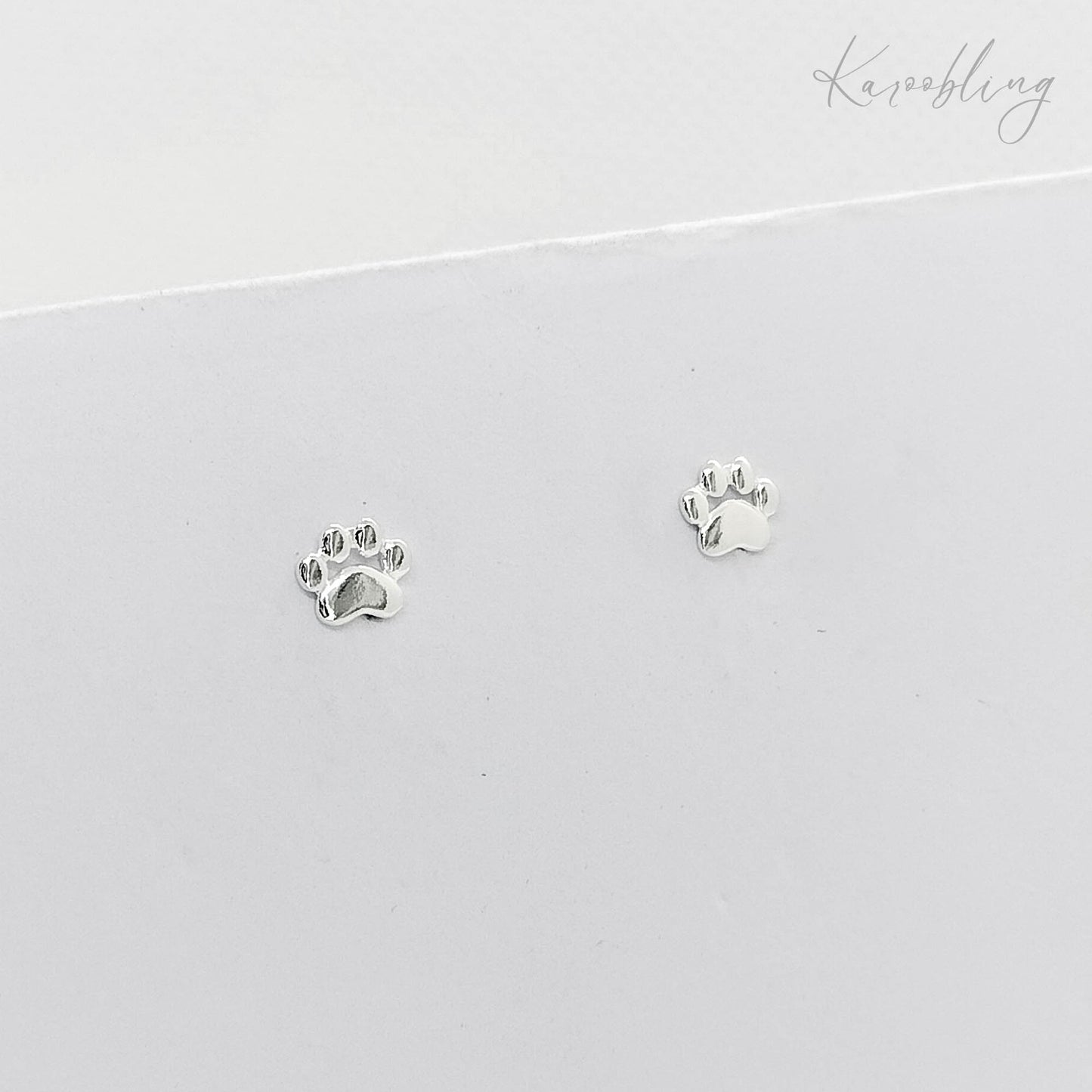 sterling silver paw print stud earrings