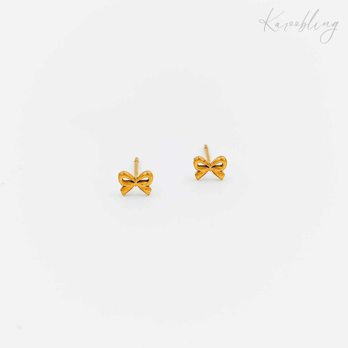 tiny gold plated bow stud earrings (water & tarnish proof)