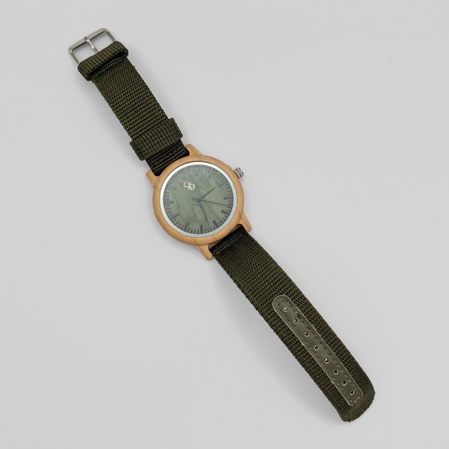 packshot of a bamboo men's watch with olive green dial and nylon strap