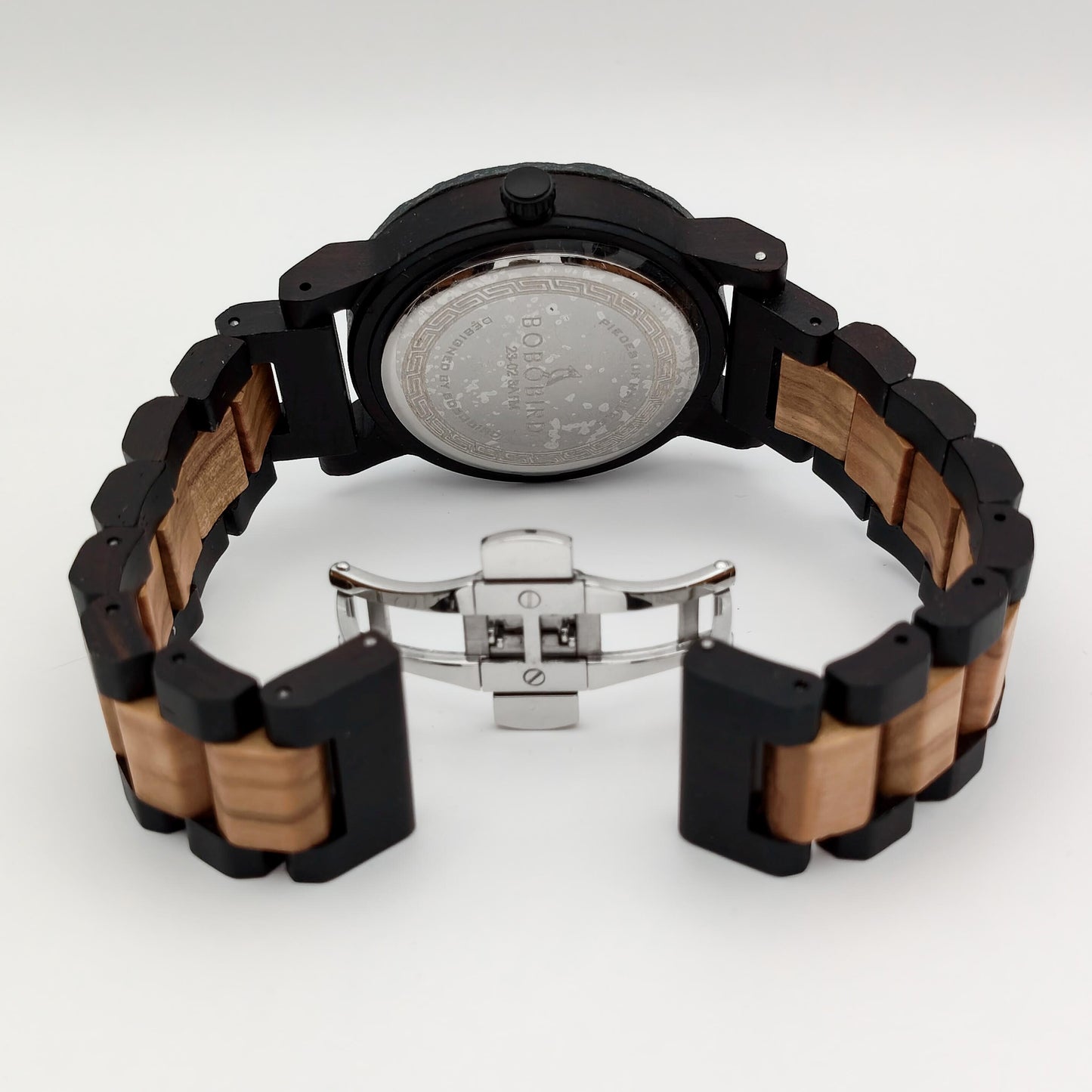 packshot of a men's zebrawood, african blackwood & rock watch
