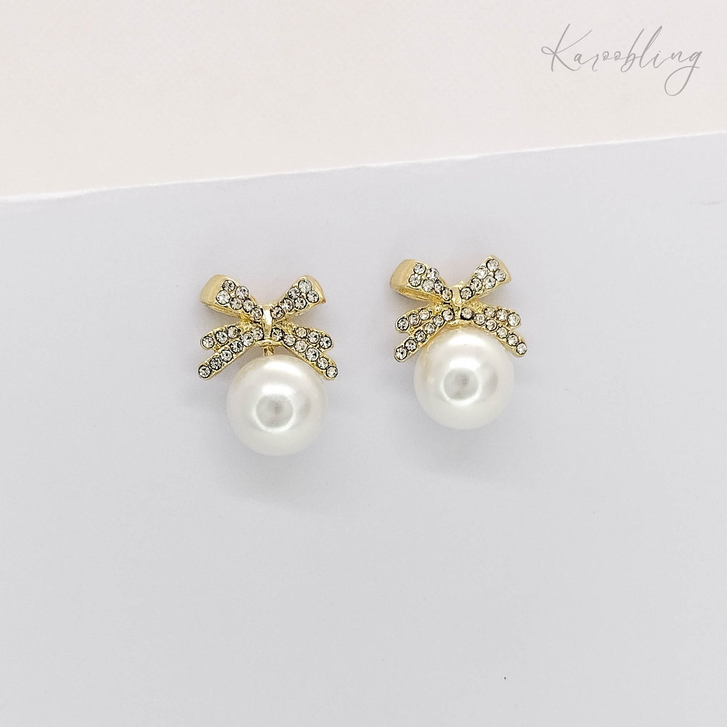 bow pearl stud earrings gold plated