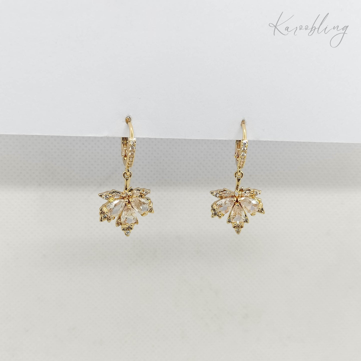 Clear CZ Maple Leaves Huggie Earrings - side angle close up