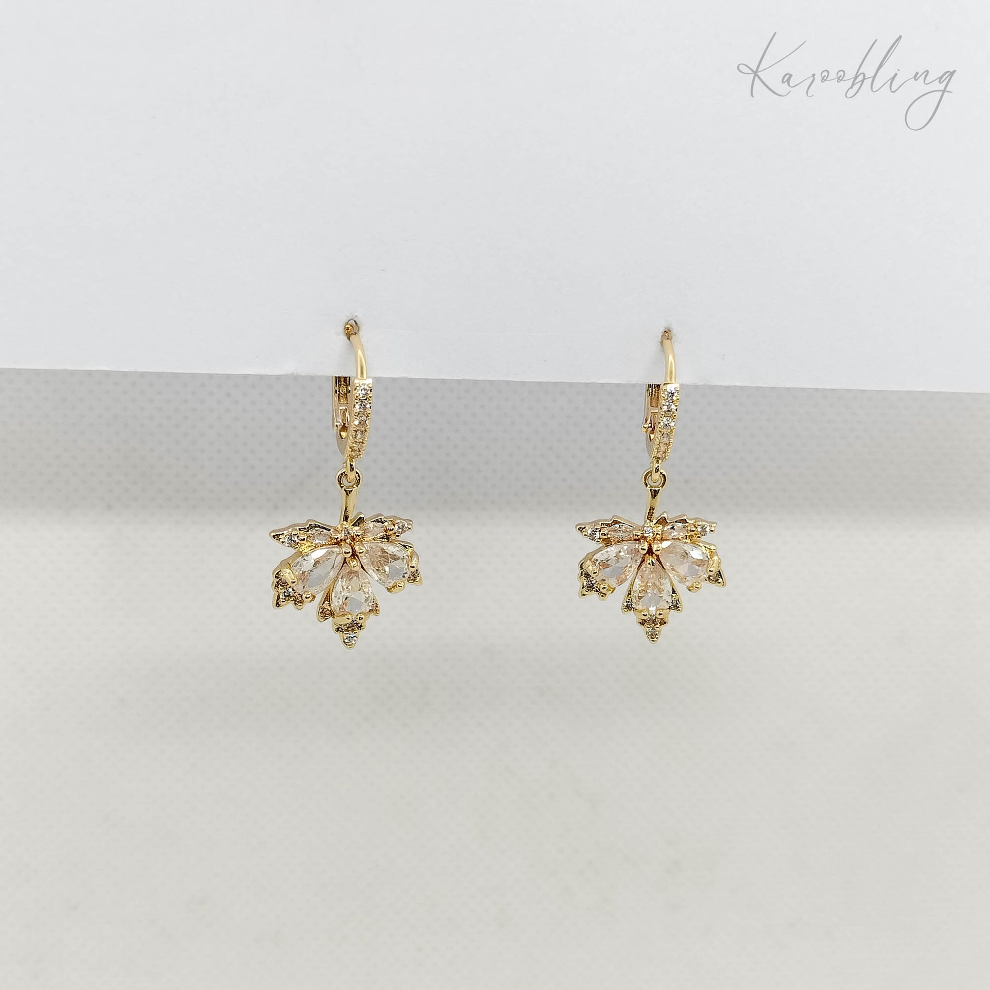 Clear CZ Maple Leaves Huggie Earrings - side angle close up