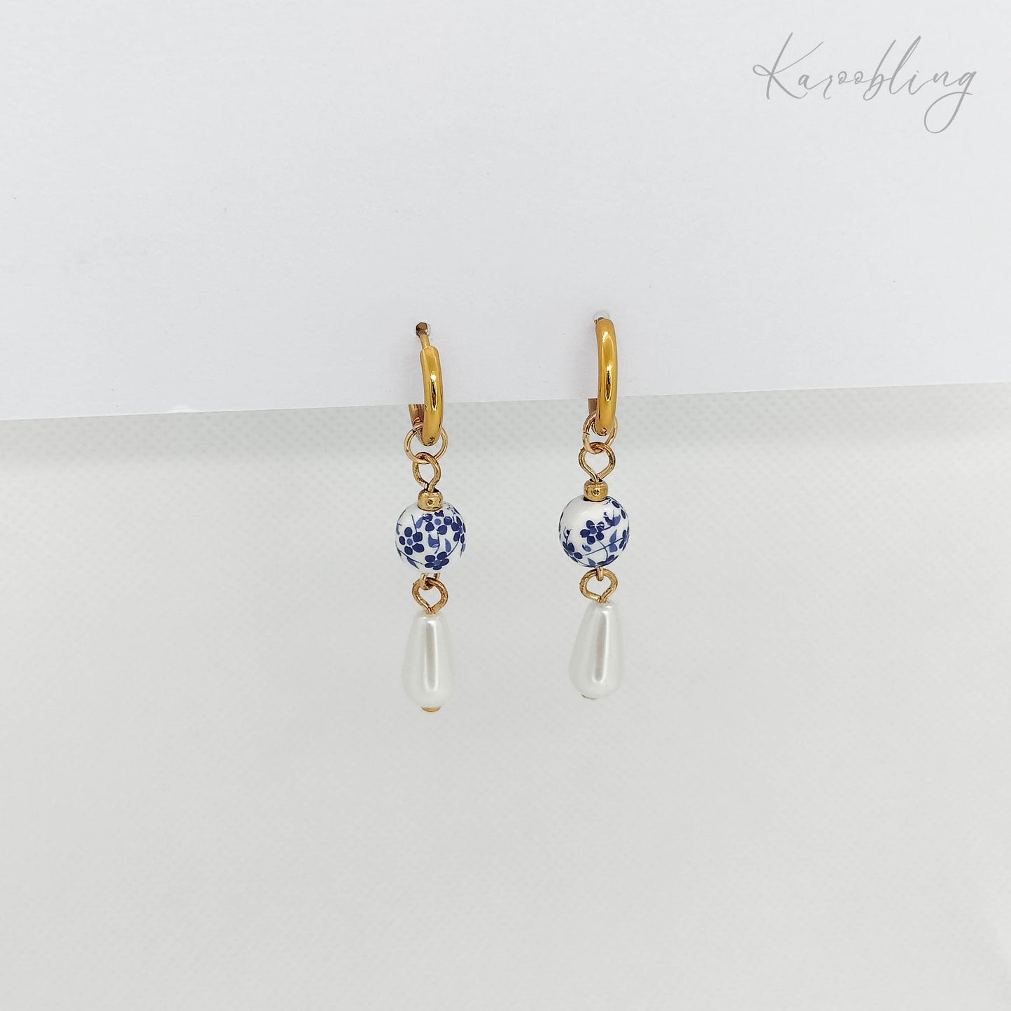 gold plated drop pearl huggie earrings