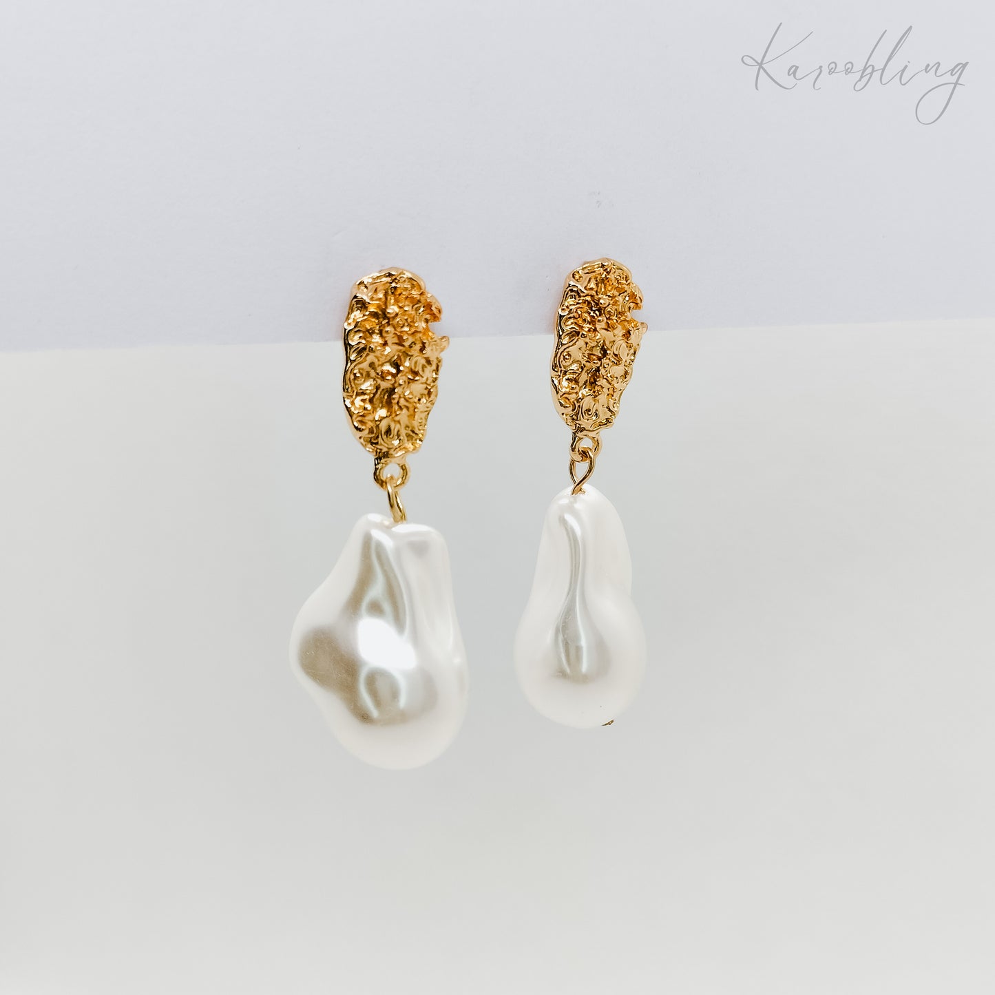 gold plated irregular dangling pearl earrings