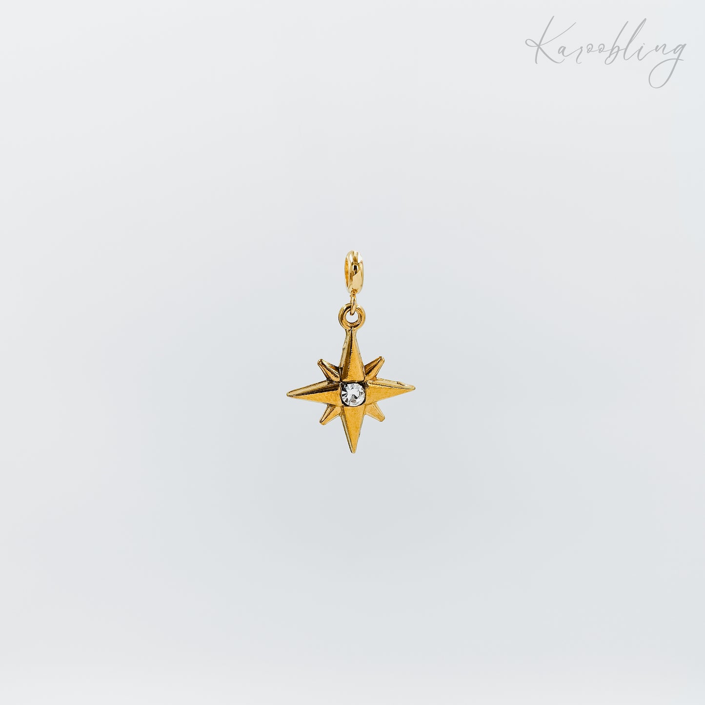 gold plated rhinestone starburst charm (water & tarnish proof)