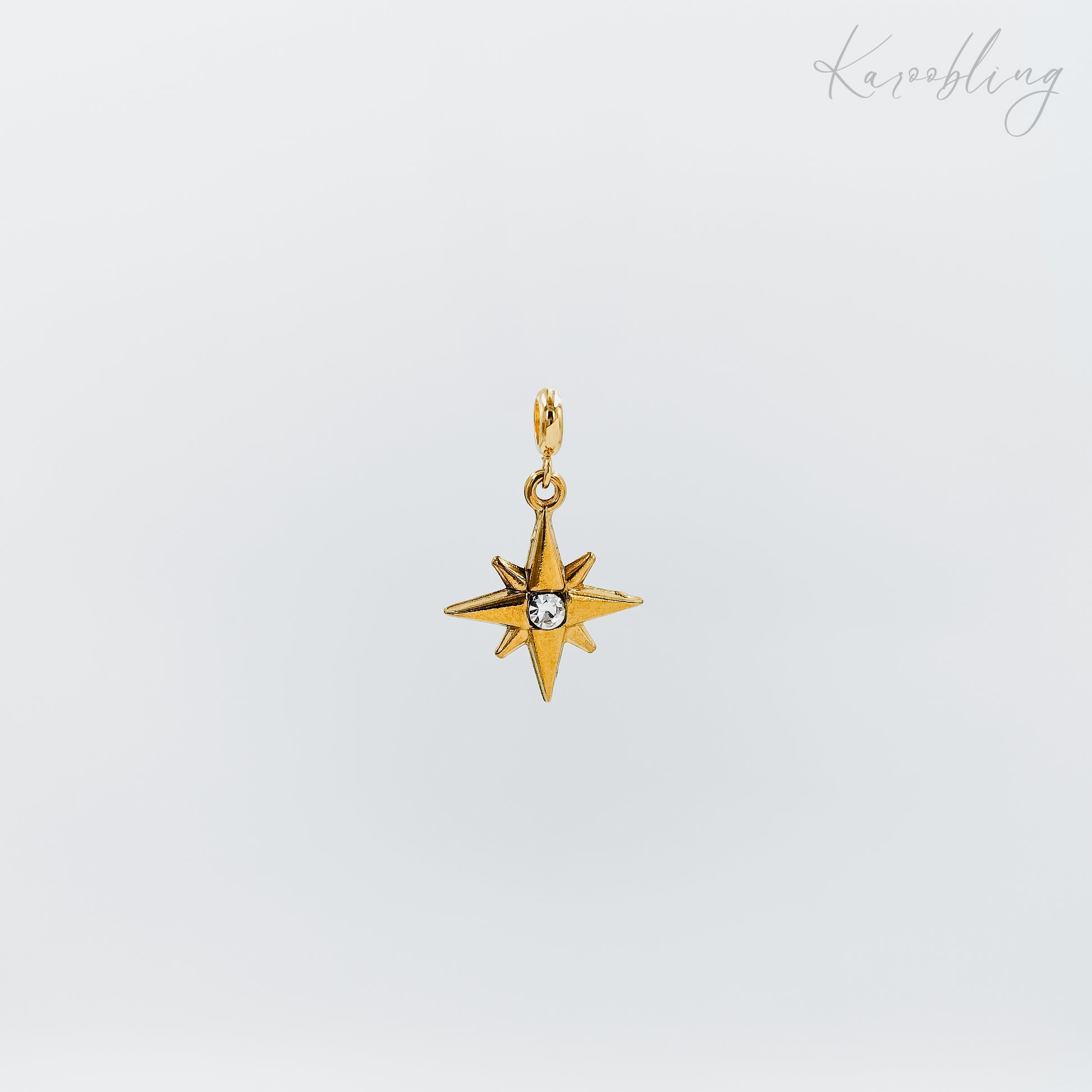 gold plated rhinestone starburst charm (water & tarnish proof)