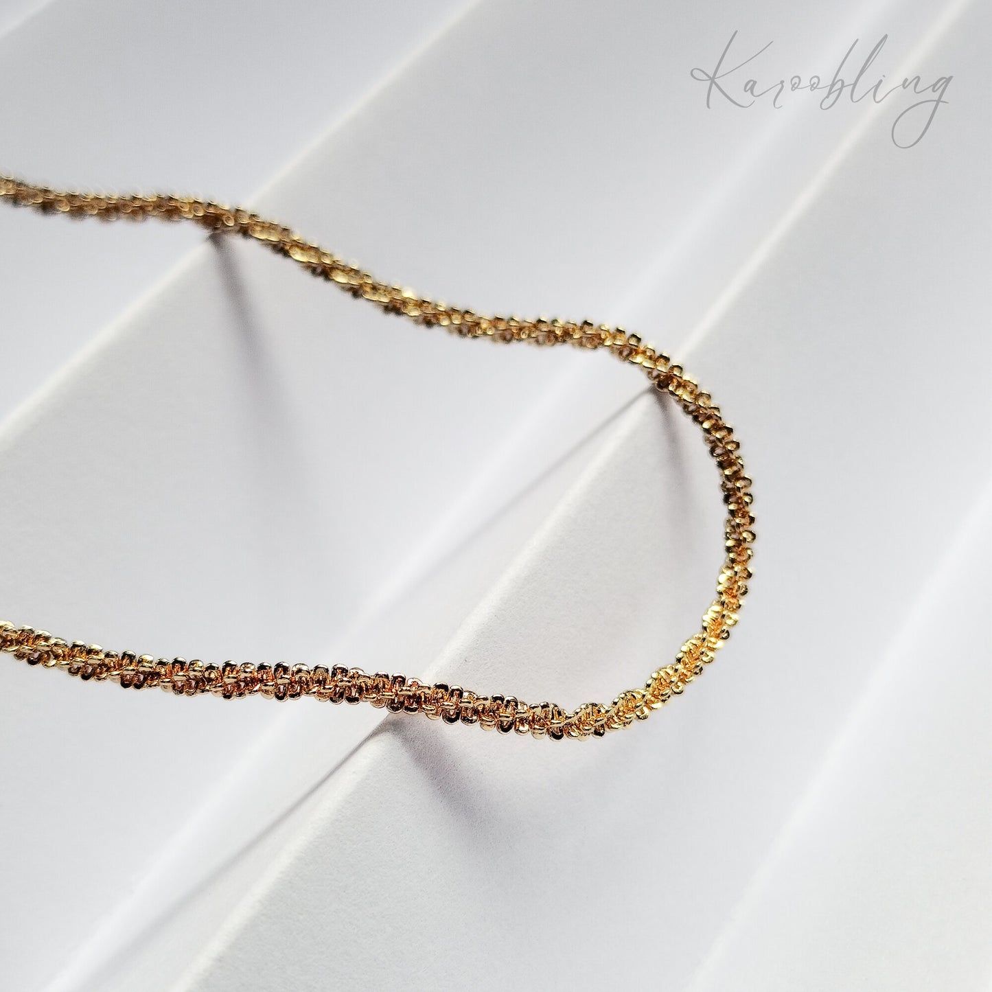 Gold TwinkleTwist Glitterstrand Necklace - close up