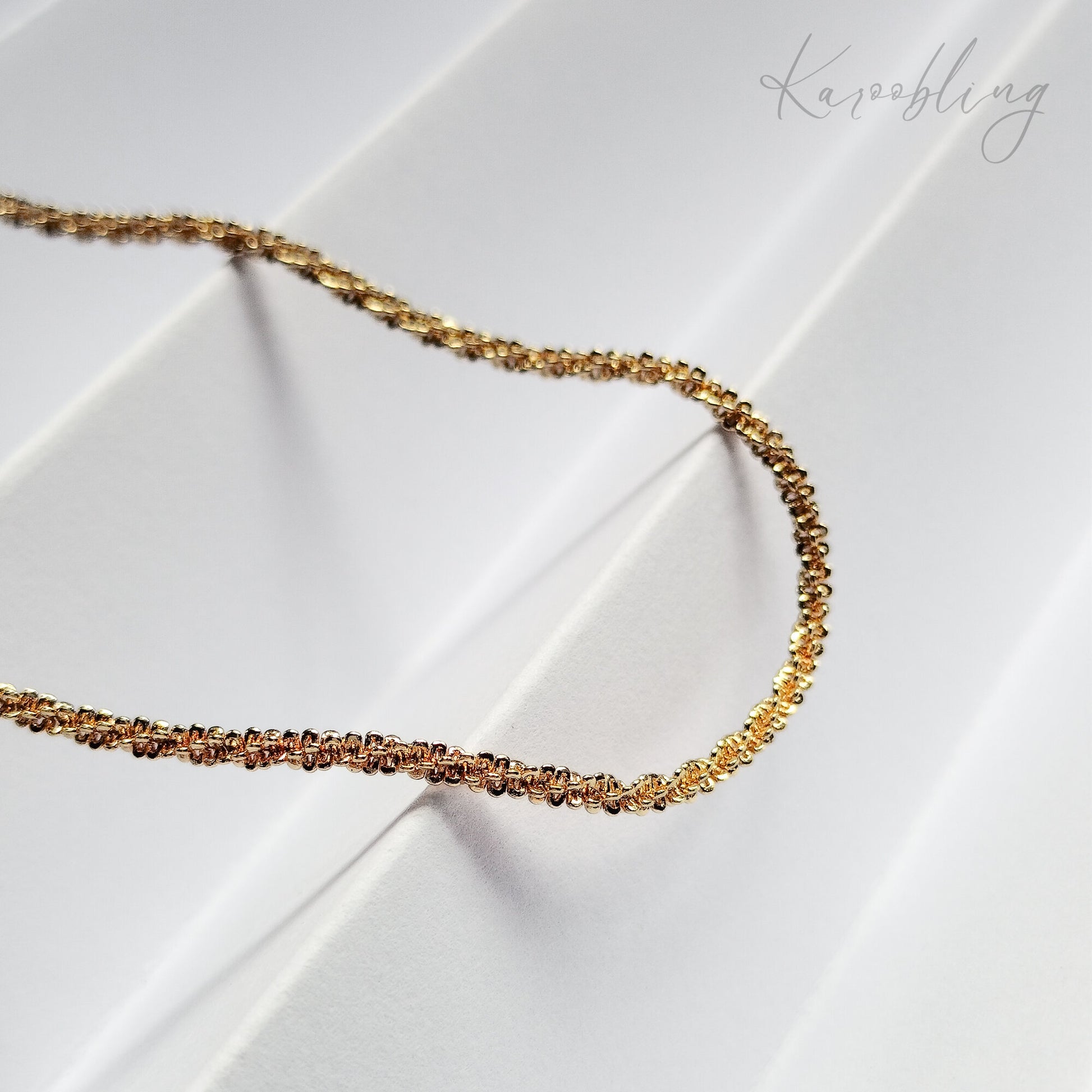 Gold TwinkleTwist Glitterstrand Necklace - close up