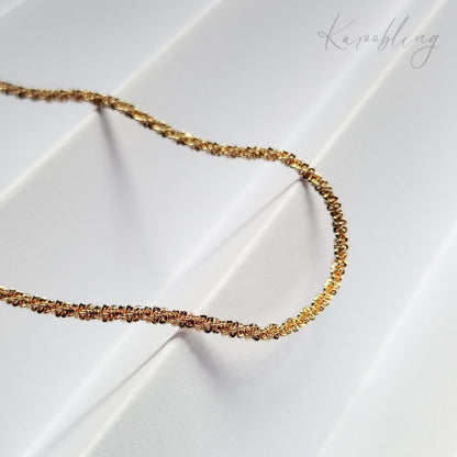 Gold TwinkleTwist Glitterstrand Necklace - close up