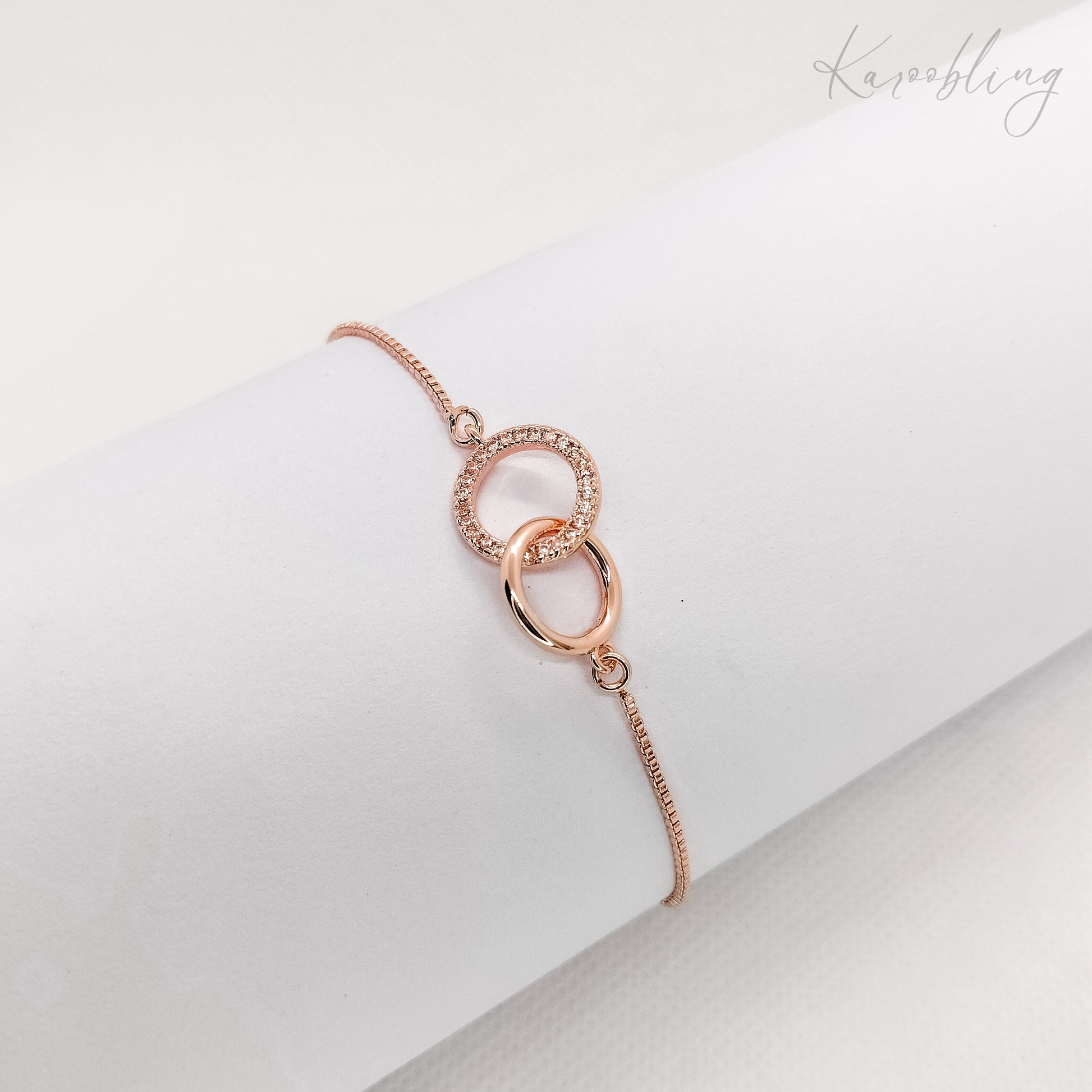 interlocking circle pullcord bracelet rose gold plated