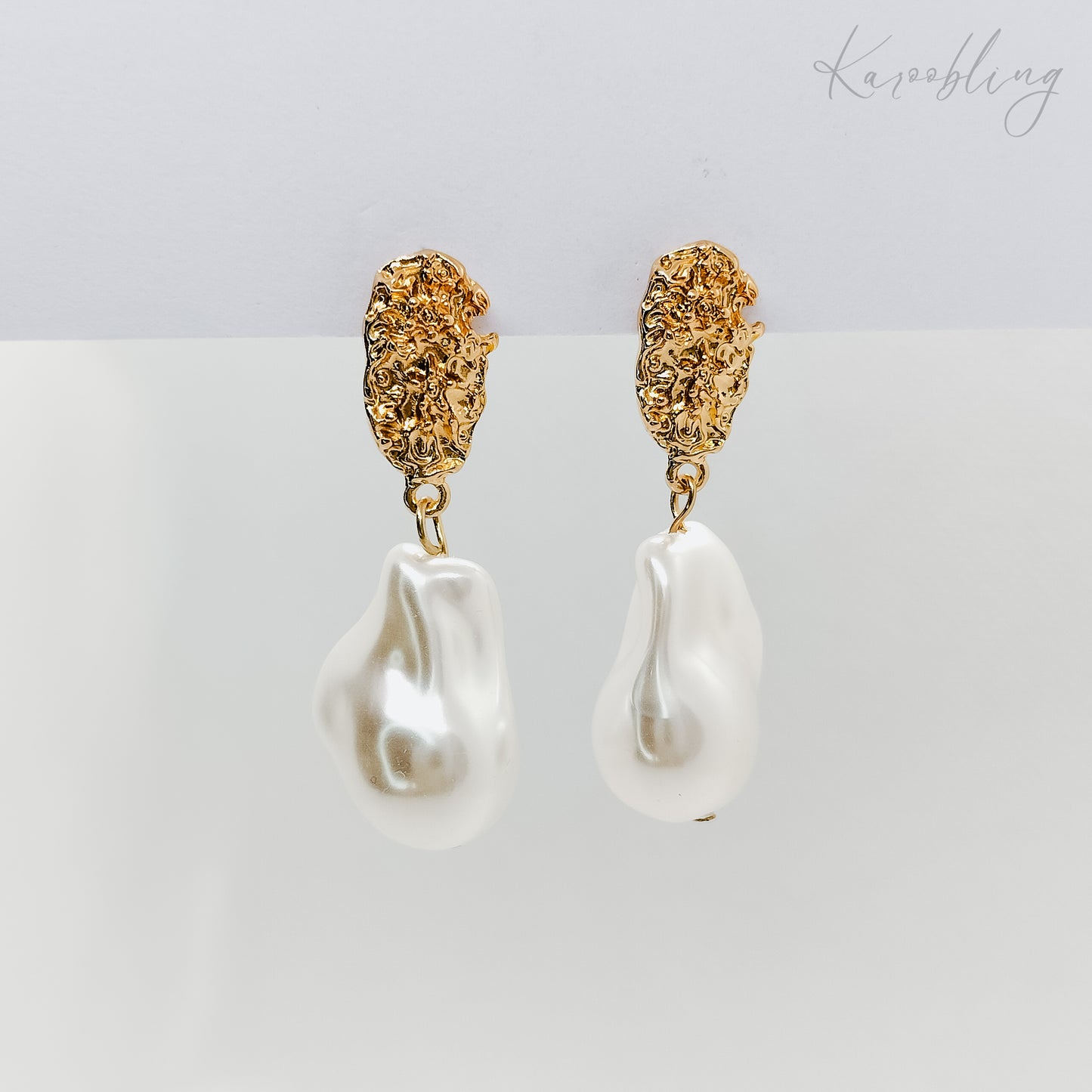 irregular dangling pearl earrings gold plated