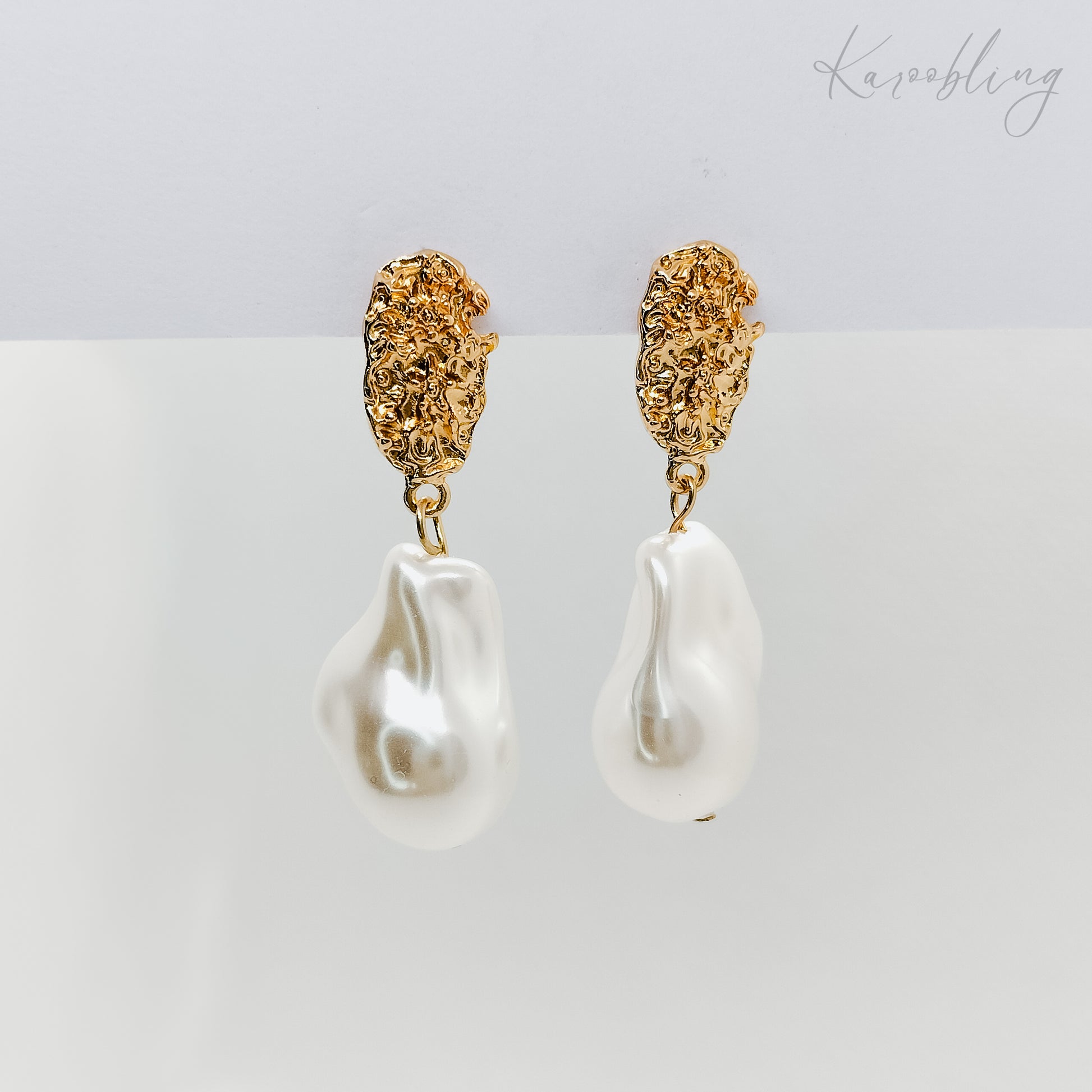 irregular dangling pearl earrings gold plated