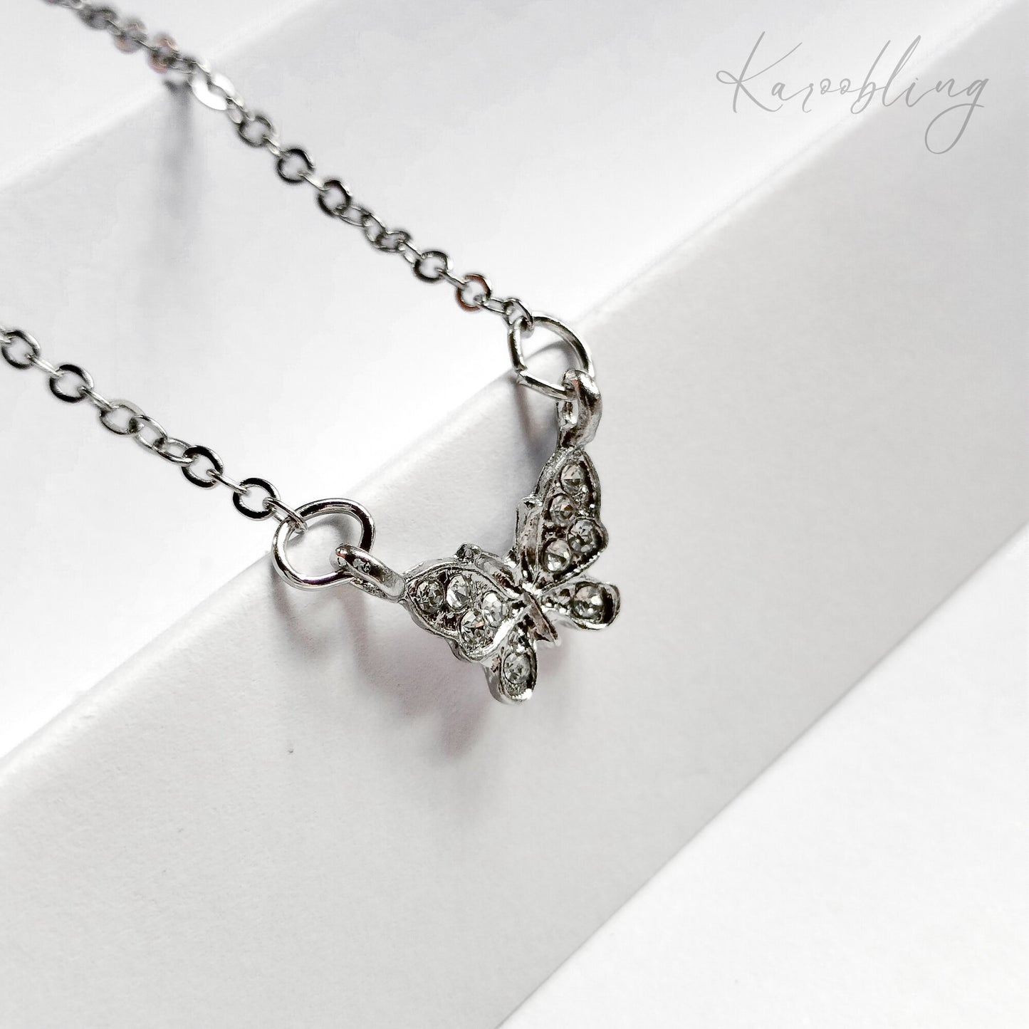 Silver FlutterGlow Butterfly Necklace - close up