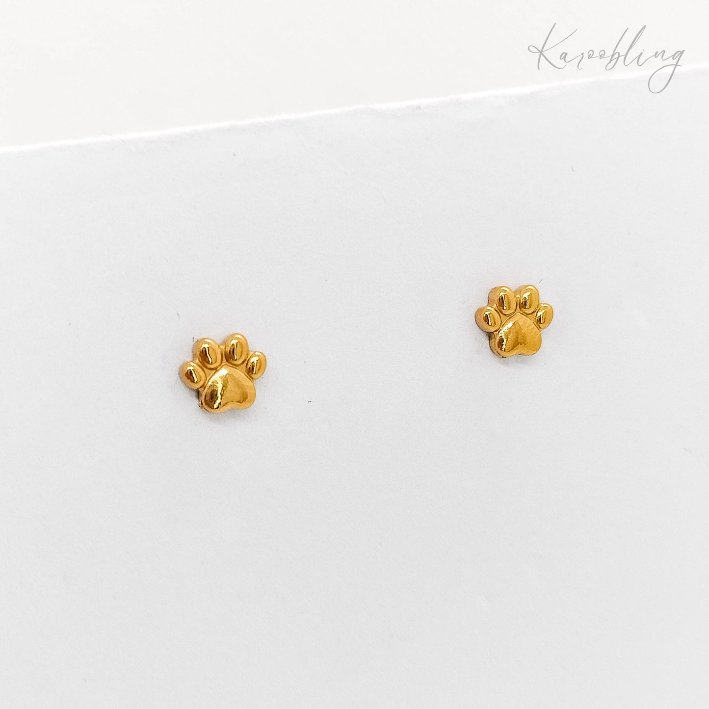 tiny gold paw print stud earrings (water & tarnish proof)