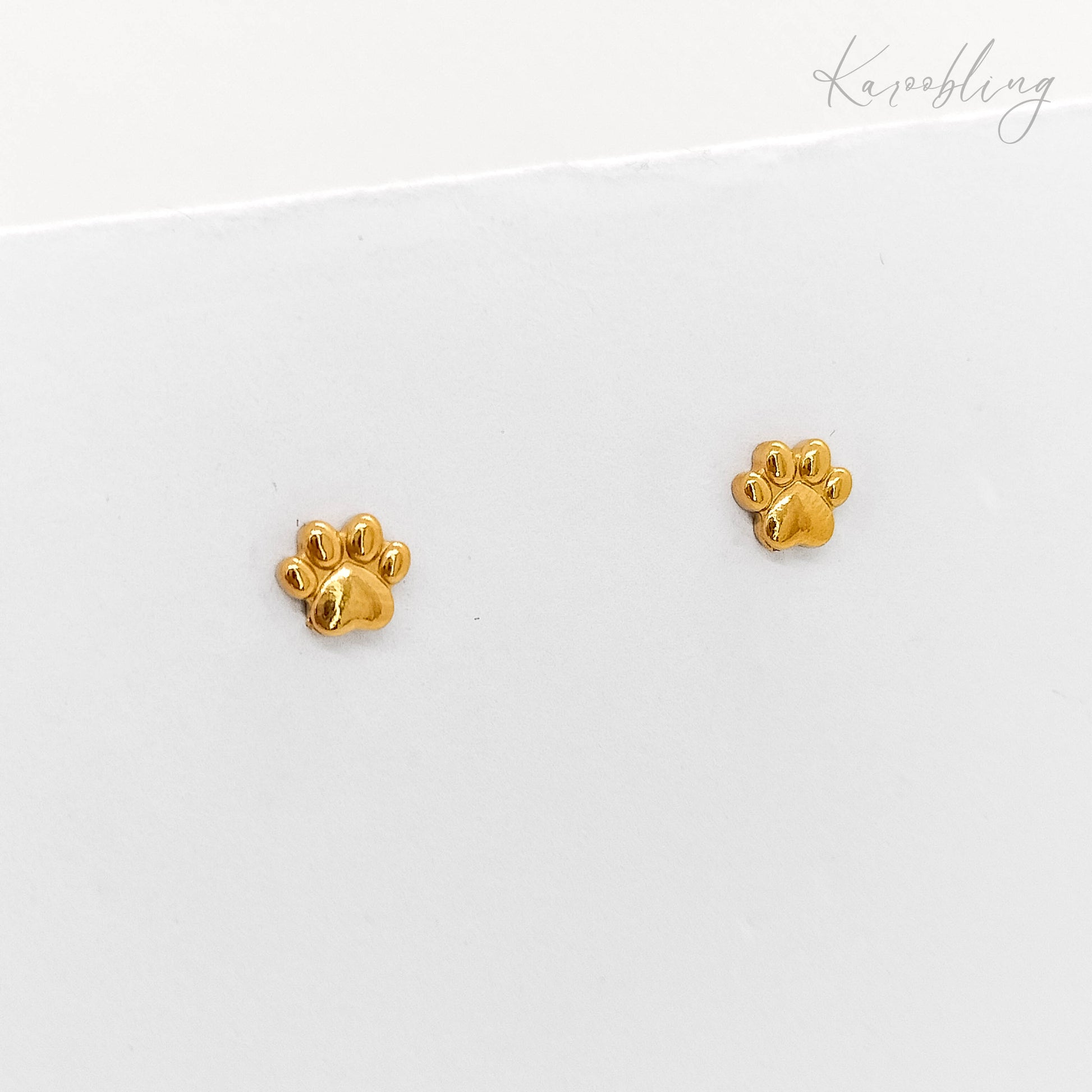 tiny gold paw print stud earrings (water & tarnish proof)