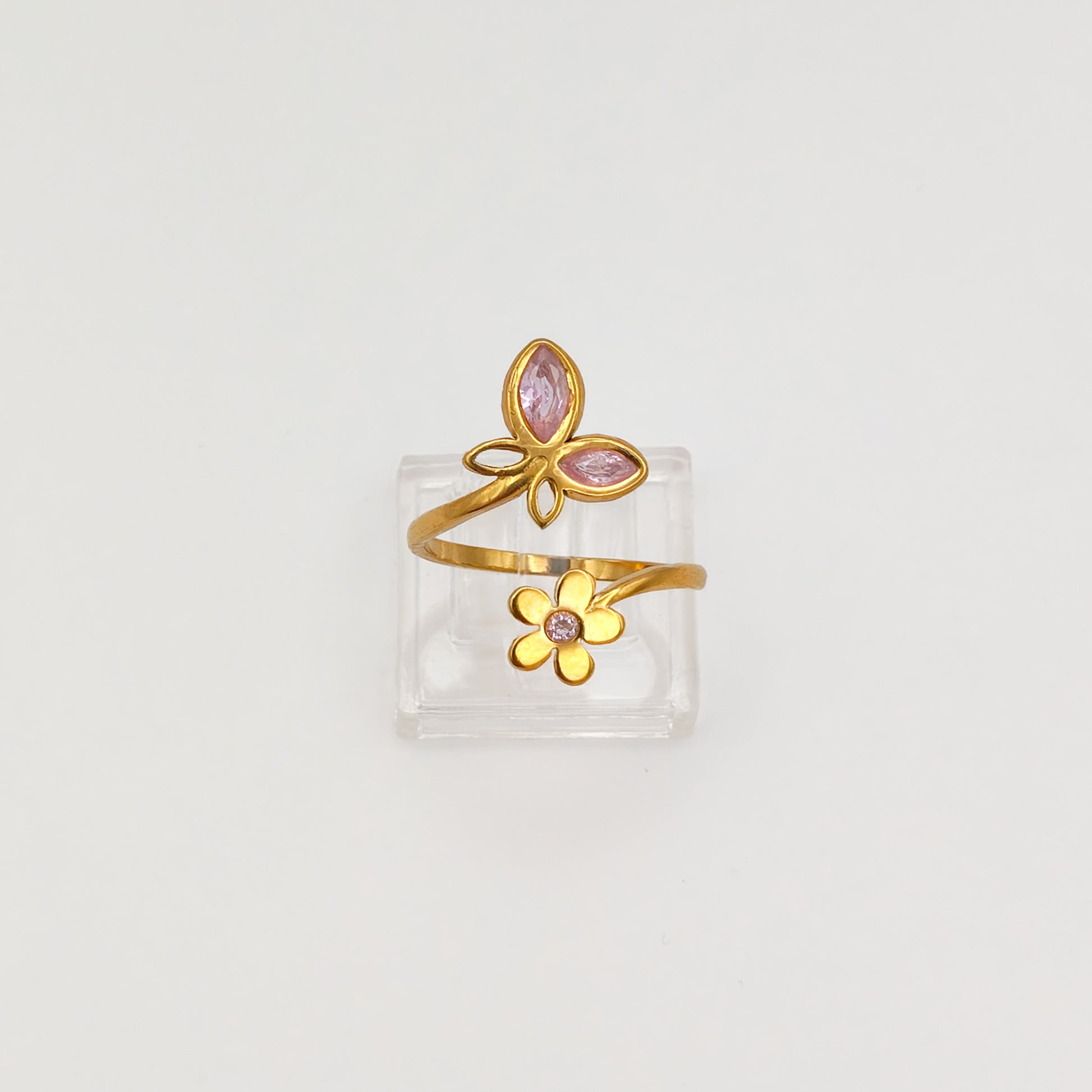 Packshot of an adjustable gold plated butterfly and flower cubic zirconia ring, waterproof and tarnish resistant