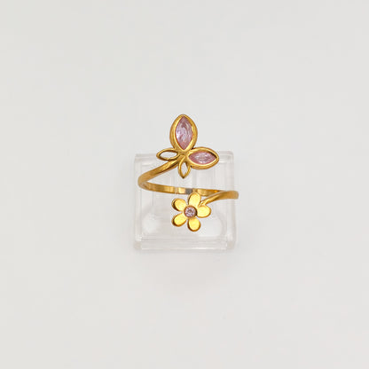 Packshot of an adjustable gold plated butterfly and flower cubic zirconia ring, waterproof and tarnish resistant