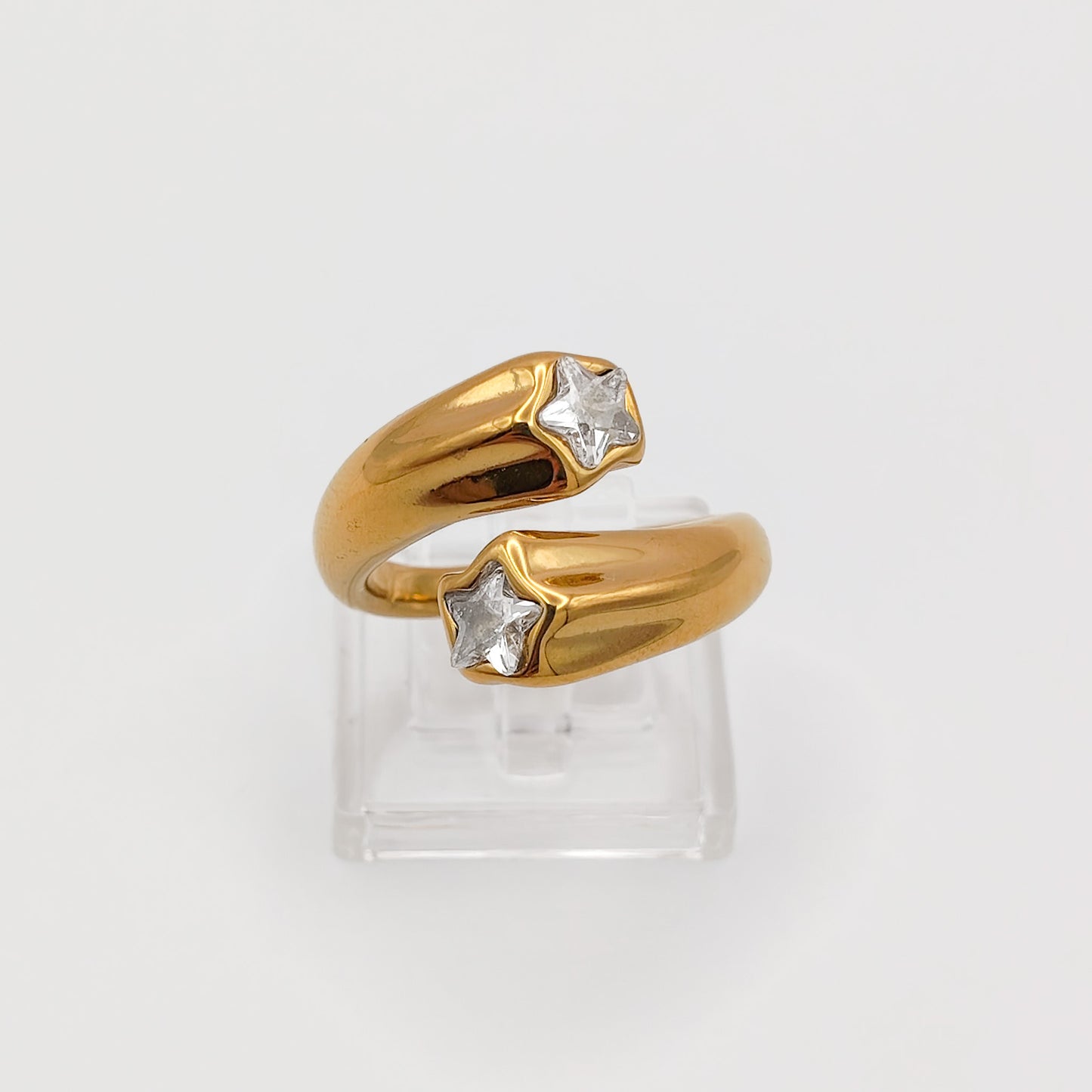Packshot of an adjustable gold plated star rhinestone ring, waterproof and tarnish resistant