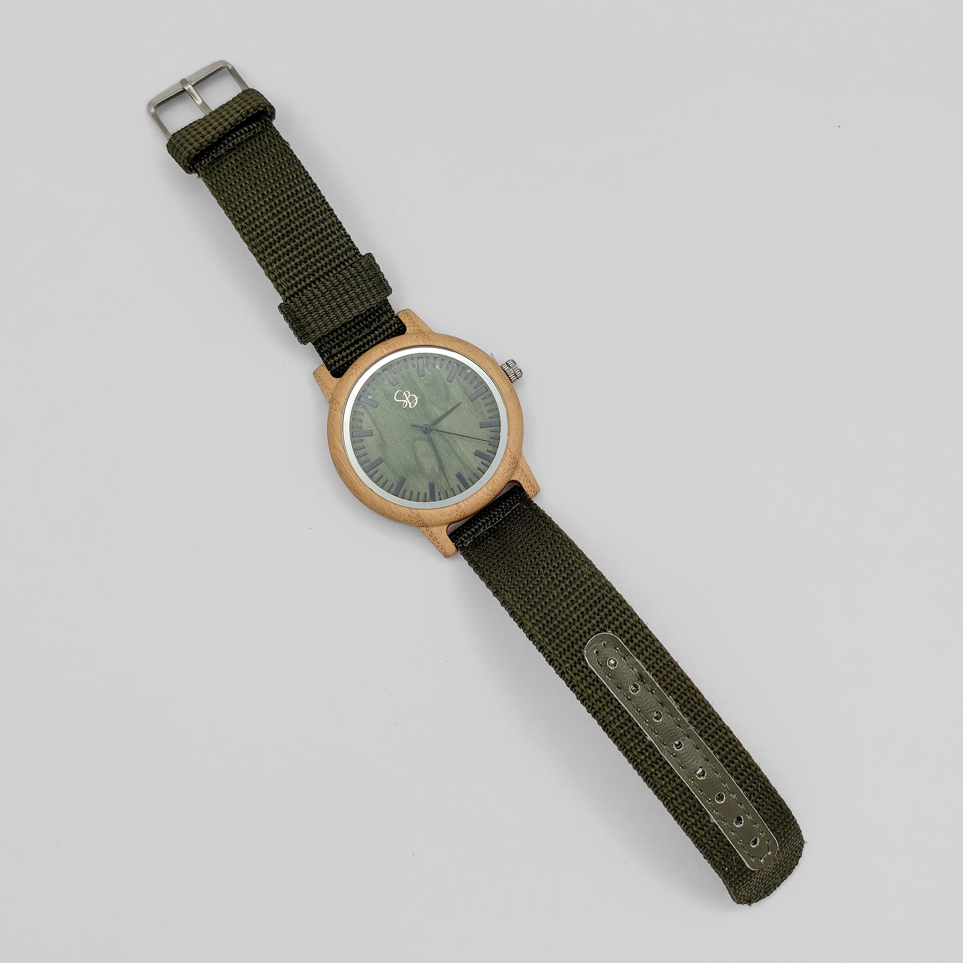 packshot of a bamboo men's watch with olive green dial and nylon strap