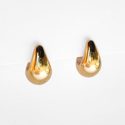 gold plated chunky teardrop stud earrings on a white display stand