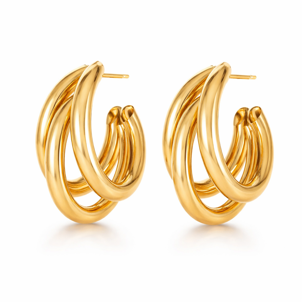 Pair of gold hoop earrings on a white background