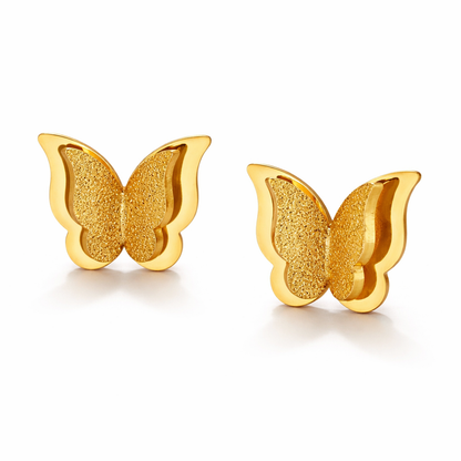 Close up of gold plated glitzy butterfly earrings