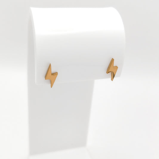 Side-angle view of gold-plated stainless steel lightning bolt post earrings showcasing their sleek geometric silhouette and bright luster.