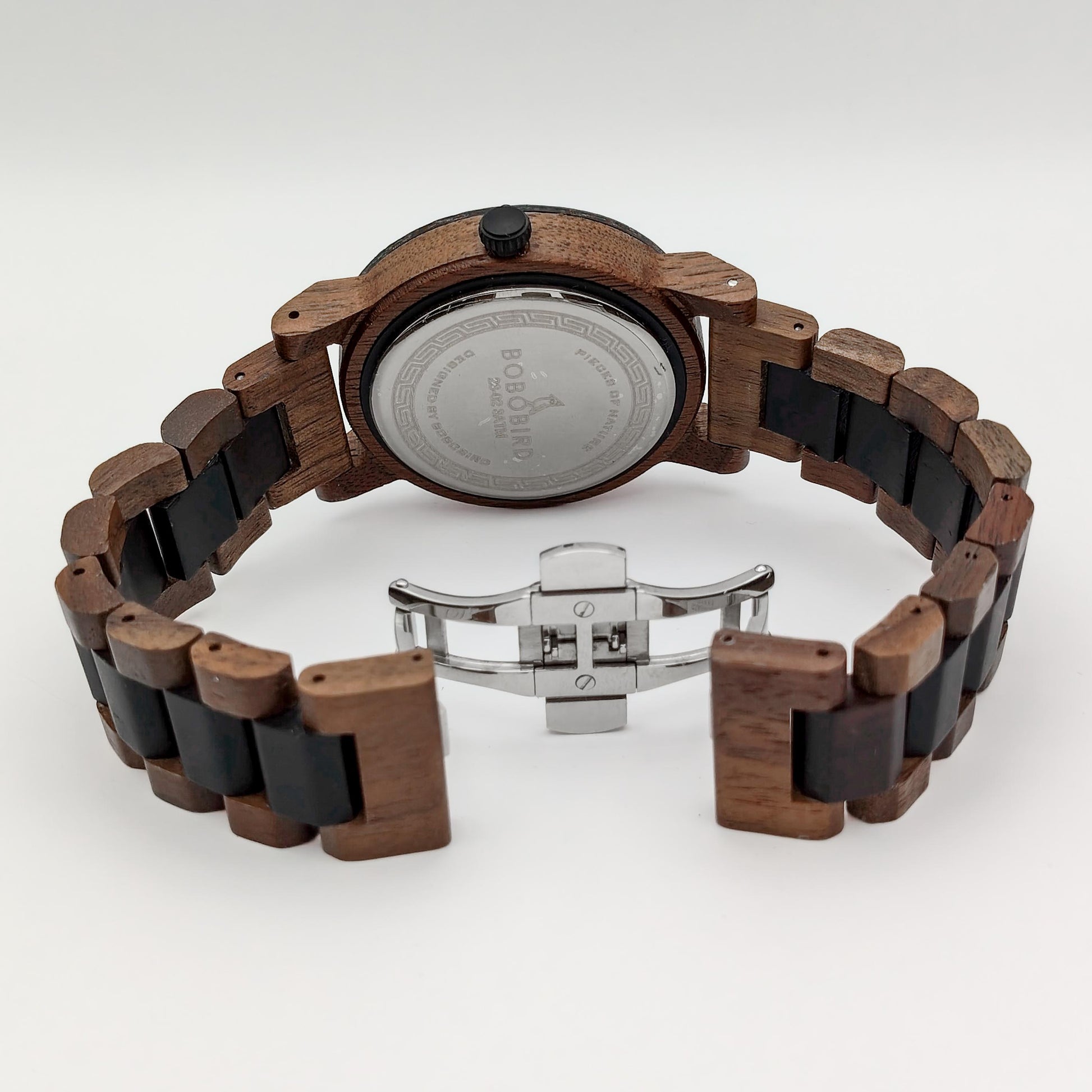 packshot of a men's walnut, african blackwood and rock watch