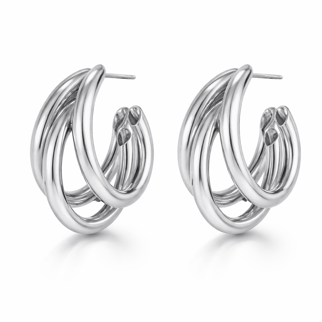 Pair of silver hoop earrings on a white background