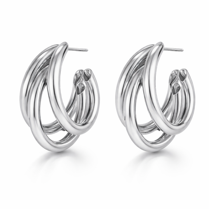 Pair of silver hoop earrings on a white background