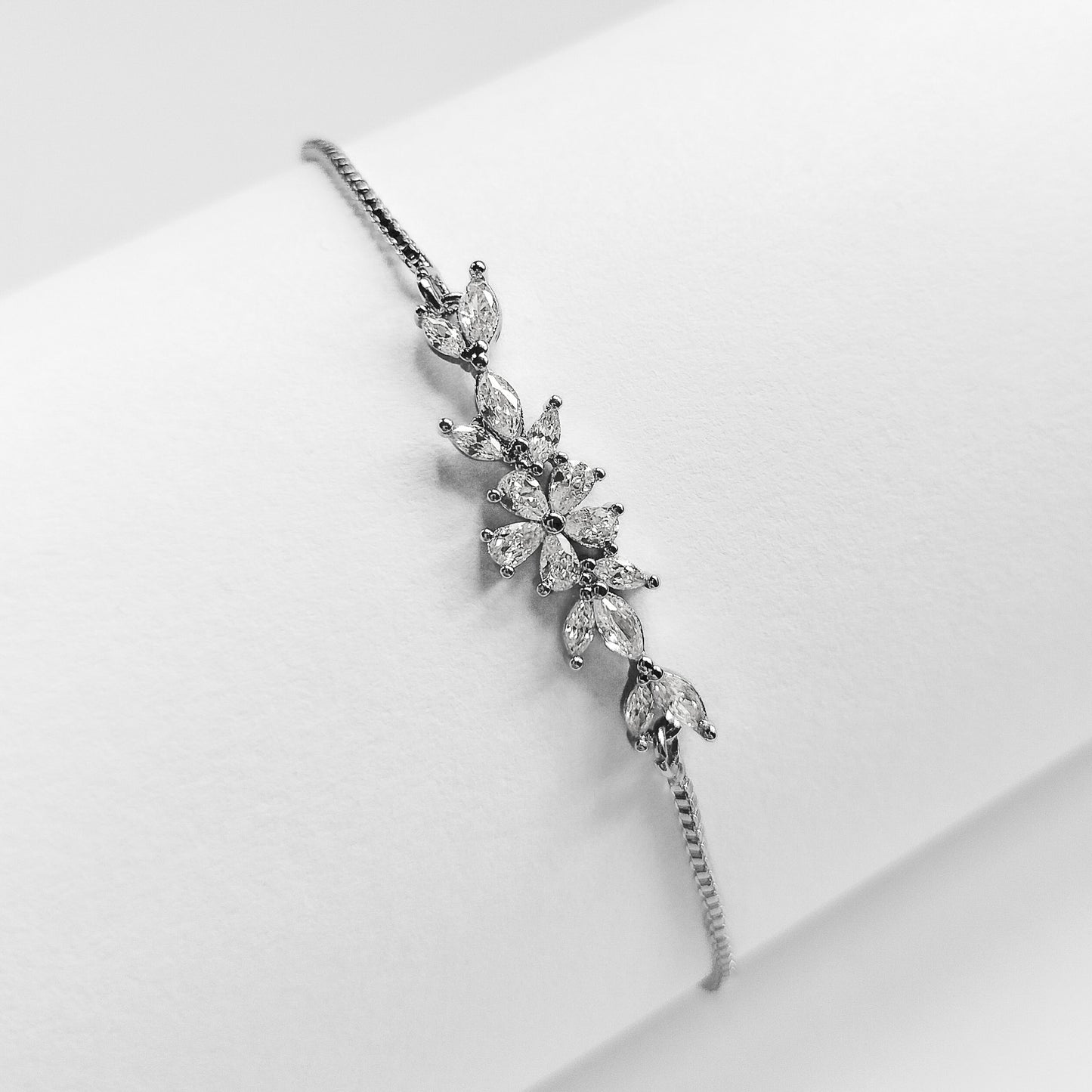 packshot of a silver plated cubic zirconia floral fashion jewellery bracelet