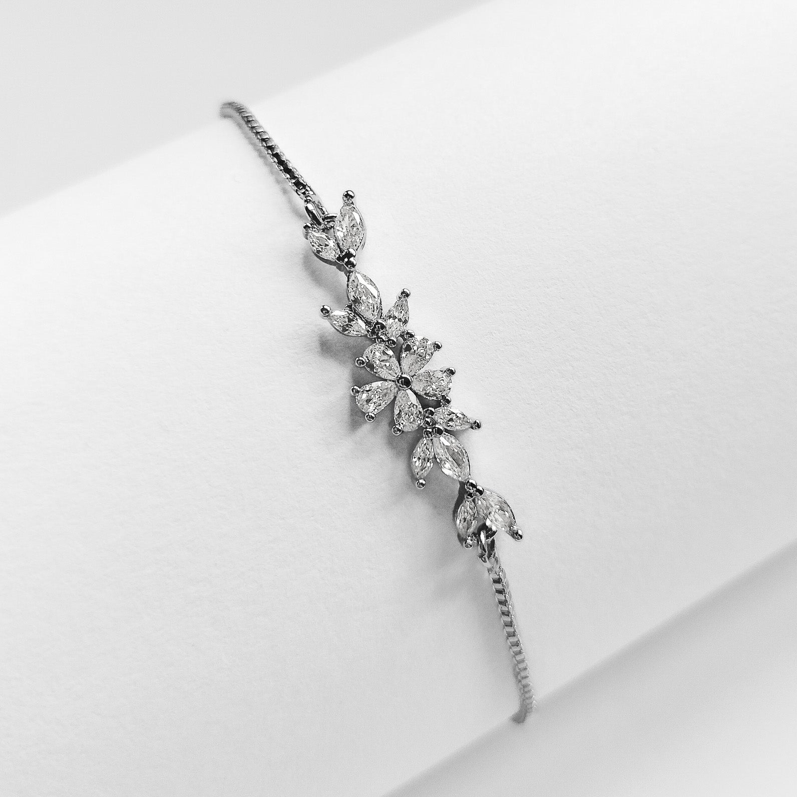 packshot of a silver plated cubic zirconia floral fashion jewellery bracelet